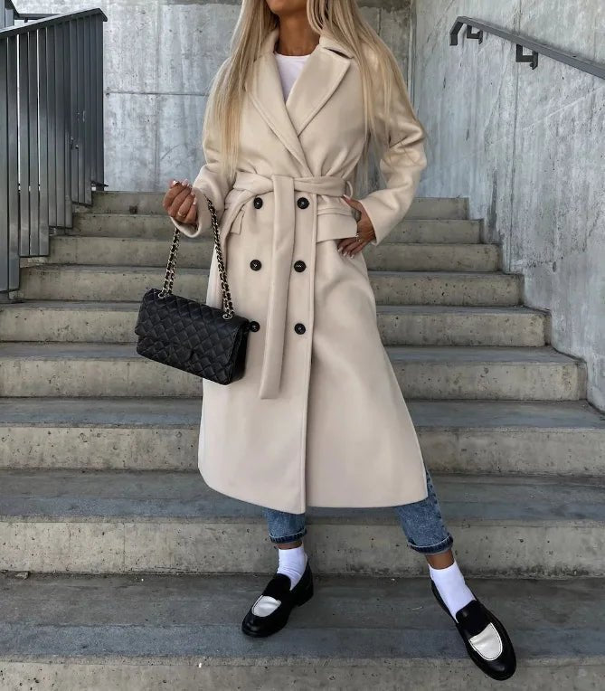 Women's long wool coat featuring a double-breasted design, elegant structured silhouette, and crafted from high-quality wool for stylish warmth and comfort. 0